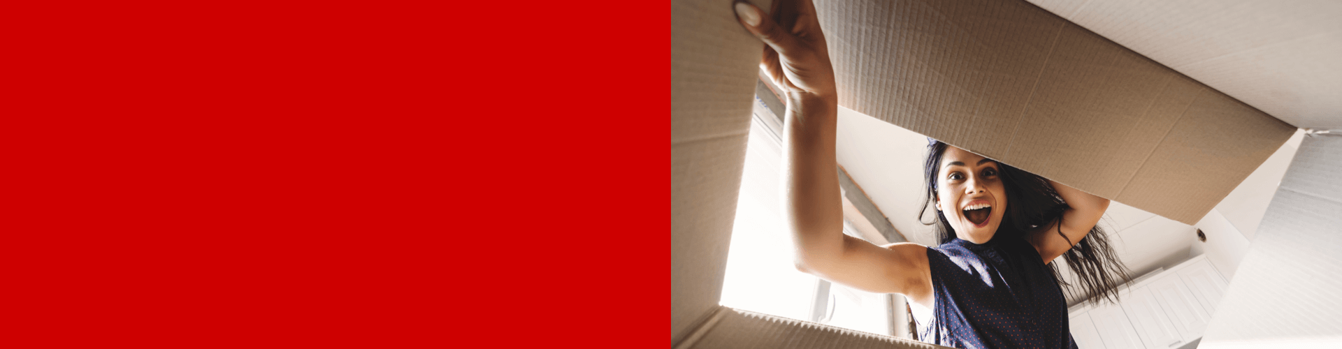 Woman looking excitedly into her Coca-Cola bundle box