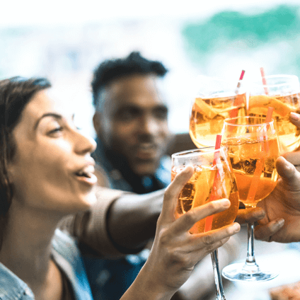 Friends celebrating with adult soft drinks and mixers