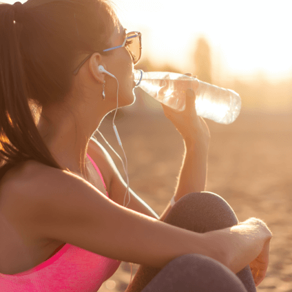 Woman enjoying a bottle of water on a run